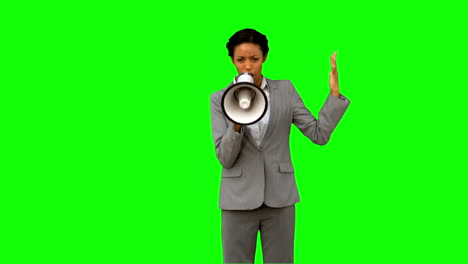 Businesswoman-yelling-into-a-megaphone-on-green-screen