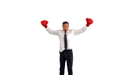 Businessman-in-boxing-gloves-jumping-and-punching-his-fists-together