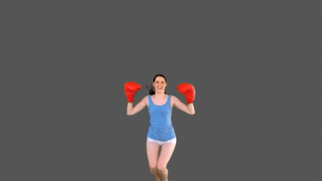 Pretty-young-model-with-boxing-gloves-jumping