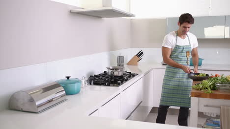 Handsome-man-cooking-vegetables