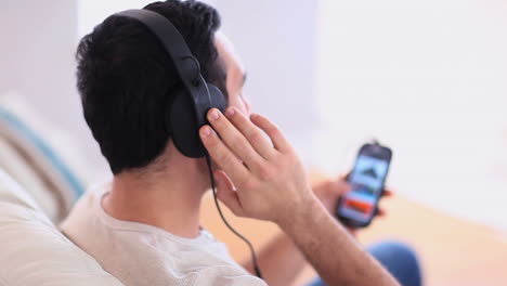 Handsome-man-listening-to-music-on-his-phone