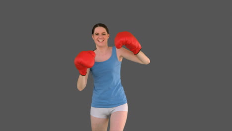 Pretty-young-model-with-boxing-gloves-punching