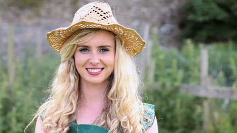 Pretty-blonde-gardener-walking-to-camera