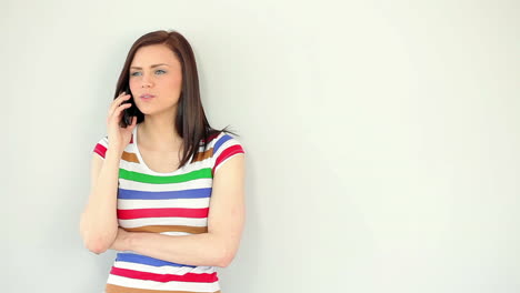 Annoyed-young-woman-talking-on-her-phone