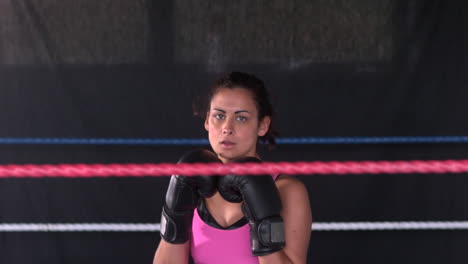 Sporty-serious-brunette-boxing