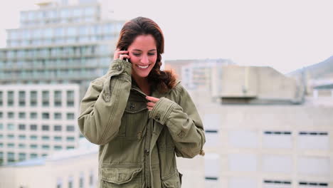 Pleased-brunette-woman-making-a-phone-call