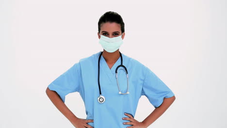 Smiling-beautiful-nurse-putting-a-surgical-mask