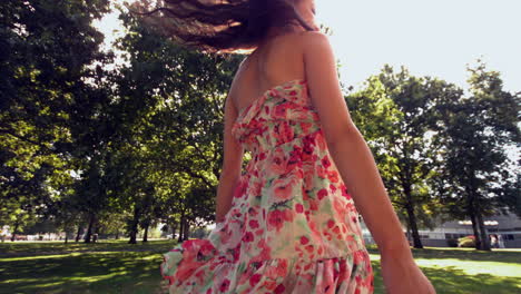 Gorgeous-happy-brunette-turning-in-sunlight