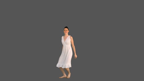 Elegant-young-model-in-white-dress-jumping