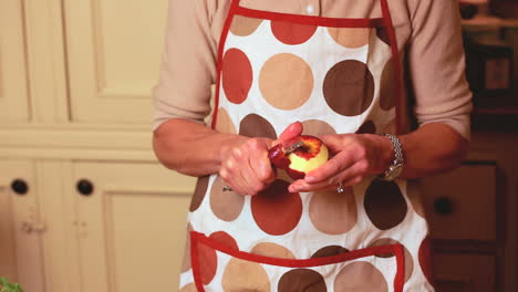 Close-up-on-hands-peeling-an-apple