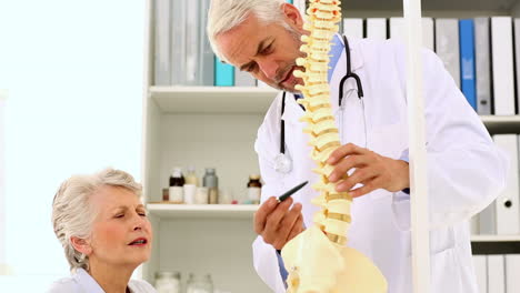 Doctor-explaining-a-spine-model-to-patient