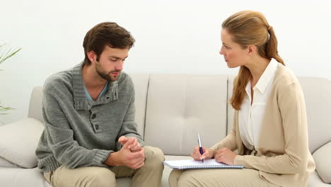 Young-man-talking-to-his-therapist