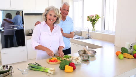 Senior-couple-preparing-vegetables-for-dinner