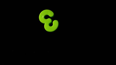 Green-number-three-falling-on-black-background