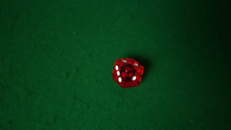 Red-dice-falling-on-casino-table