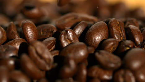 Coffee-beans-pouring-onto-more-beans