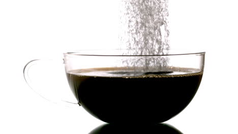 Sugar-pouring-into-cup-of-tea