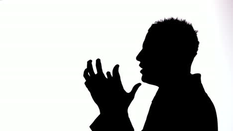 Silhouette-of-businessman-giving-out-on-white-background