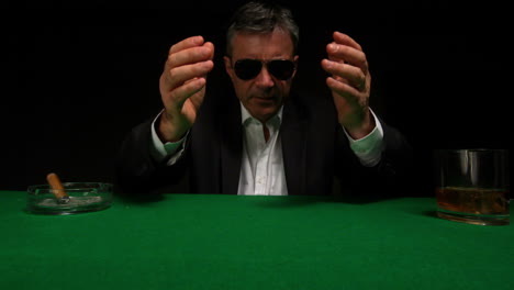 Gambler-losing-and-putting-head-in-hands