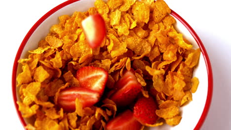 Strawberries-falling-into-bowl-of-cereal