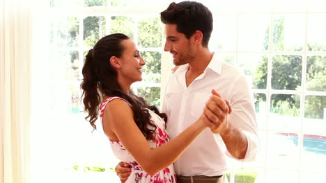 Attractive-young-couple-dancing-together