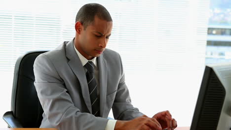 Businessman-working-at-his-desk