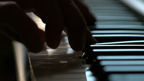 Fingers-playing-on-the-keys-of-a-piano