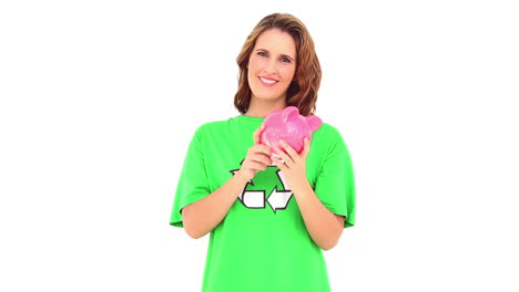 Smiling-environmental-activist-showing-piggy-bank