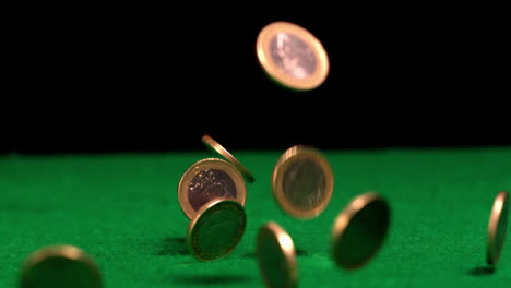 Many-euro-coins-falling-on-casino-table