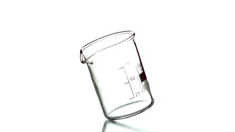Empty-beaker-spinning-on-white-background