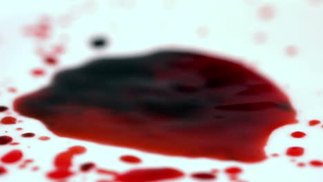 Blood-dropping-onto-white-surface