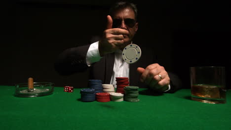 Cool-gambler-throwing-chips-to-camera