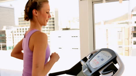 Fit-woman-running-on-treadmill