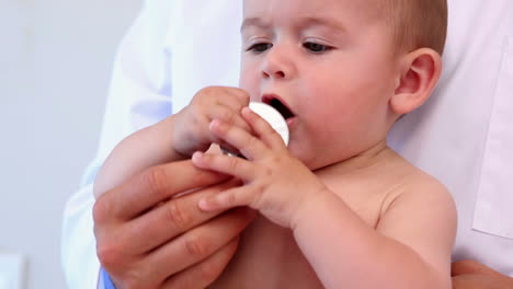 Pediatrician-examining-baby-boy