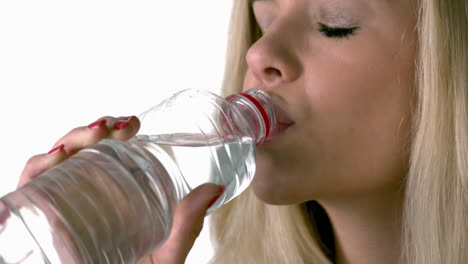 Pretty-blonde-drinking-from-water-bottle