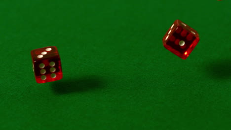 Red-dice-falling-on-casino-table