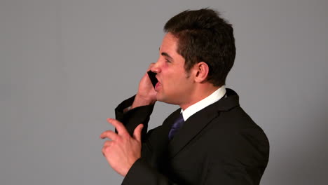 Angry-businessman-shouting-on-the-phone