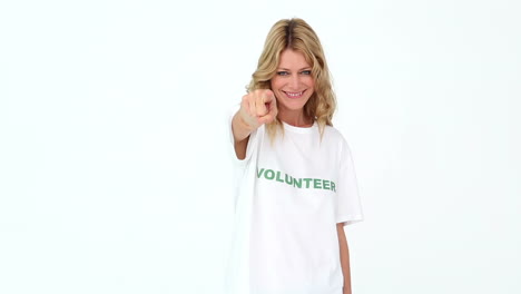 Pretty-volunteer-pointing-to-camera
