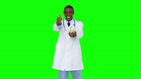 Feliz-Joven-Doctor-Mostrando-A-La-Cámara-Una-Manzana