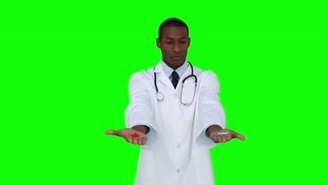 Serious-young-doctor-showing-tablets-to-camera
