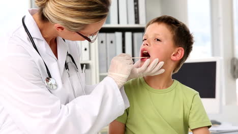 Doctor-checking-little-boys-tonsils