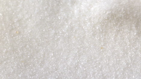 White-sugar-pouring-onto-more