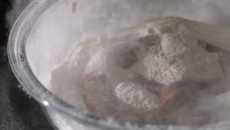 Pretzel-falling-into-bowl-of-flour