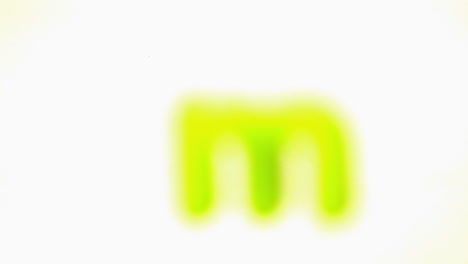 Green-letter-m-lifting-off-white-background