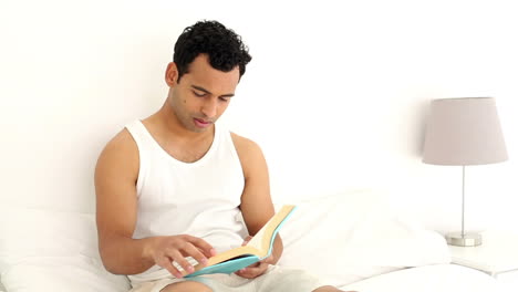 Happy-handsome-man-reading-a-book