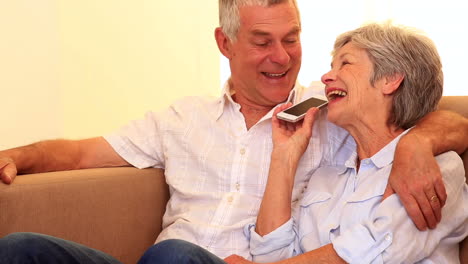 Affectionate-senior-couple-on-the-phone-together