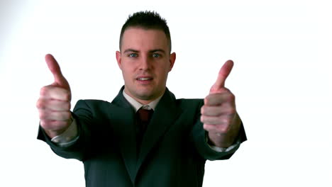 Businessman-giving-thumbs-up-to-camera
