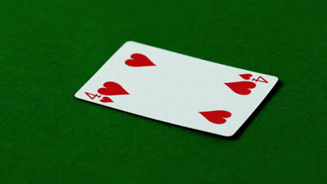 Four-of-hearts-falling-on-casino-table