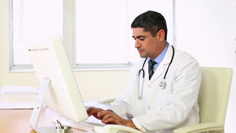 Doctor-working-at-his-computer