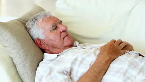 Senior-man-sleeping-on-the-couch